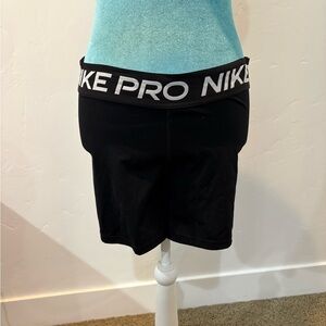 Nike Pro gray athletic shorts (mid-thigh length, black)